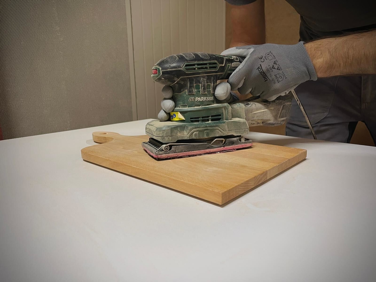 A man working with wooden product